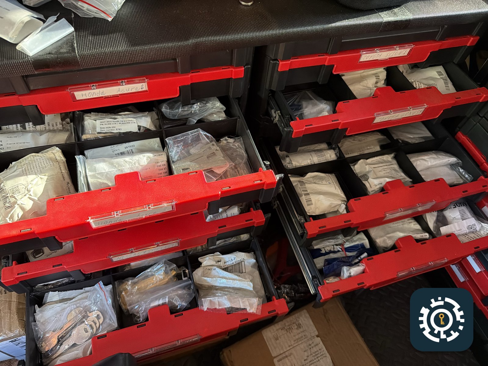 Locksmith van parts inventory organized and labeled by vehicle make
